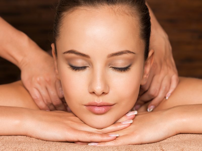 Closeup portrait of beautiful young woman with closed eyes relaxing in the spa salon. Beauty treatment concept.